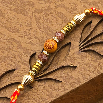 Well Formed Rings & Beads OM Design Rakhi for Brother