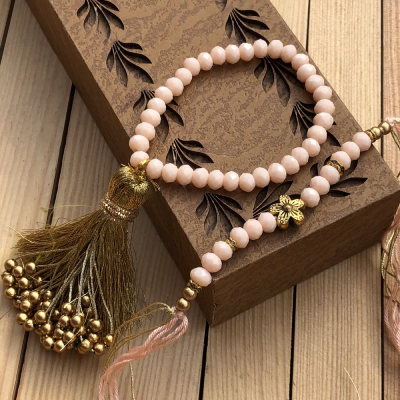 Beautiful Peach Pearl Rakhi Set for Bhaiya Bhabhi