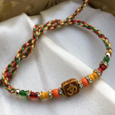 Traditional Om with Beads Thread Rakhi for Brother