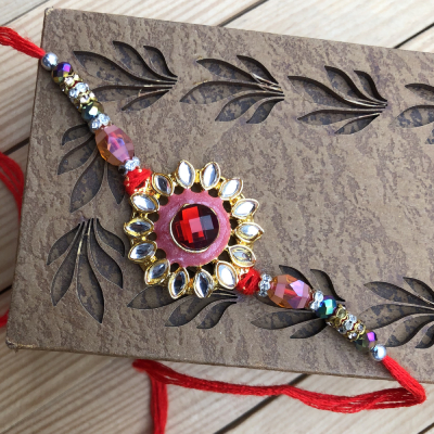 Trendy Red Stone Fancy Kundan Design Rakhi for Brother