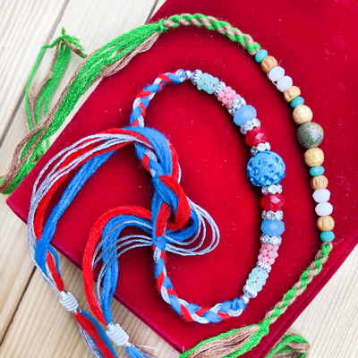Appealing Rakhi Set of 2 Handicrafted Beads Thread for Brother