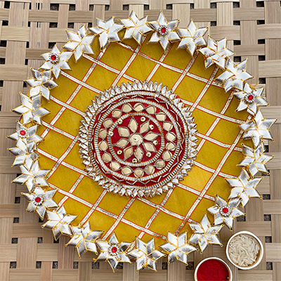 Auspicious Rakshabandhan Pooja thali decorated with handmade Gota patti flowers