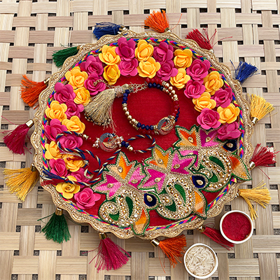 Peacock designed Bhaiya bhabhi bracelet and dora Rakhi combo with Pooja Thali