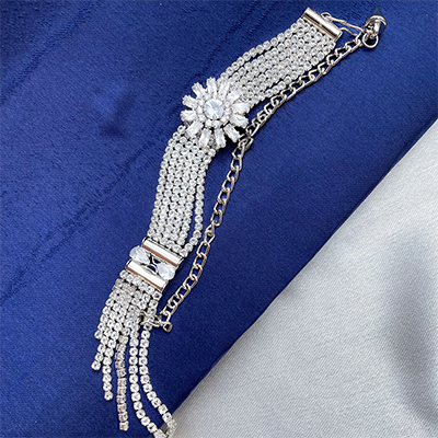 silver tone fully diamond flower based bracelet Rakhi for bhabhi