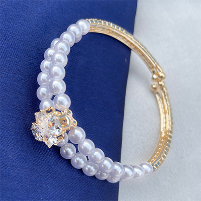Fashionable pearls and american diamond bracelet rakhi for bhabhi